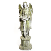 Standing angel with a serene facial expression holding a scalloped bowl on an ornate hexagonal pedestal.