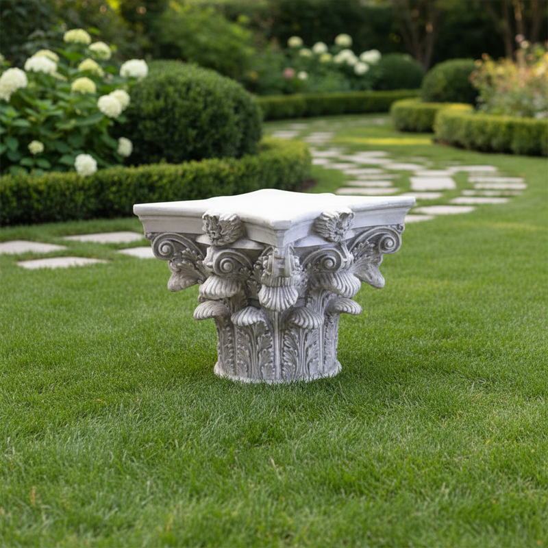 Corinthian column capital with ornate acanthus leaves and classical old world European detailing in a Renaissance style Side Angle