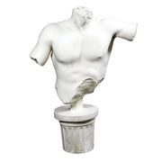 Classical Greek male torso sculpture with missing head and arms, displayed on an ornate fluted pedestal in old world European style.