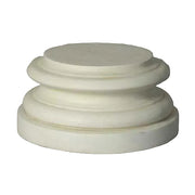 Classical round pedestal base with layered, ornate molding in an old world European architectural style.