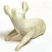 Seated pig figurine with gentle expression, sculpted in an old world European classical style with smooth, ornate detailing. Side View