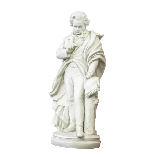 Classical European statue of a composer in ornate attire, holding a manuscript, draped in a flowing cloak, on a round pedestal.
