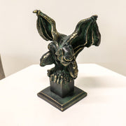 Gothic gargoyle statue with outstretched wings and crouching pose on a square pedestal, featuring ornate medieval detailing. Different Angle