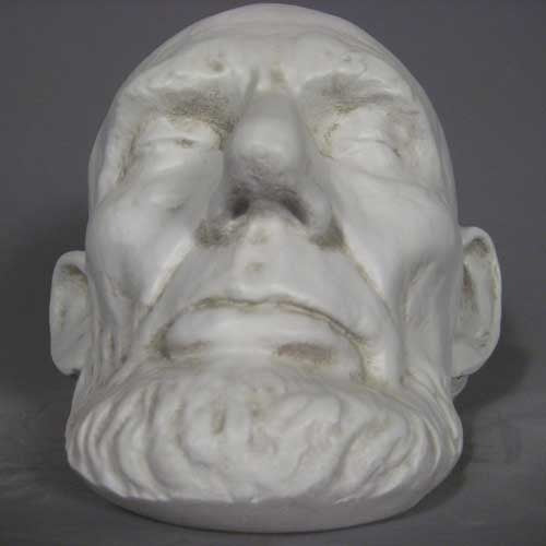 Classical old world European sculpted head with closed eyes, detailed facial features, and a prominent beard in Renaissance style. Different Angle