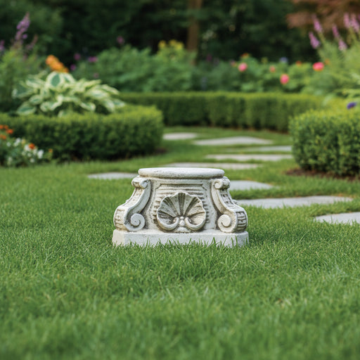 Ornate pedestal base with classical scrollwork, shell motif, and old world European architectural detailing in a Baroque style. Side Angle
