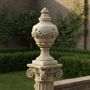 Ornate classical urn with Baroque floral garland, fluted pedestal base, and old world European decorative detailing. Side Angle