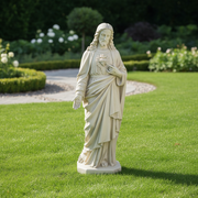 Sacred Heart of Jesus statue in classical old world European style with flowing robes and ornate detailing, standing on a pedestal. Side View