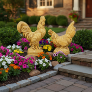 Baroque-style rooster and hen figurines with ornate detailing and classical European sculptural accents on round bases. Side Angle