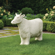 Classical old world European cow statue with detailed fur texture and stylized features in a traditional sculptural style. Side Angle