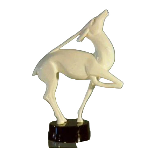 Graceful classical deer sculpture with elongated limbs and arched neck, standing on a round base in an old world European style.