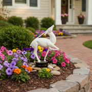Graceful classical deer sculpture with elongated limbs and arched neck, standing on a round base in an old world European style. Side Angle