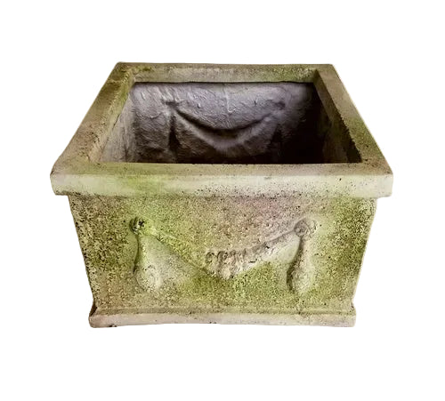 Square planter with ornate old world European detailing, featuring classical garland relief and weathered, aged finish.