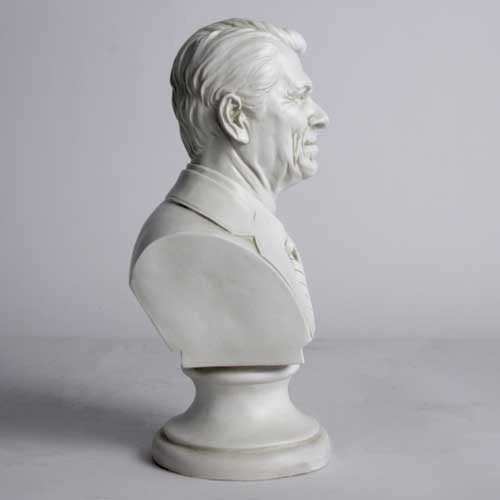 Classical-style bust of a distinguished man in a suit and tie with detailed facial features and an ornate pedestal base. Other Angle