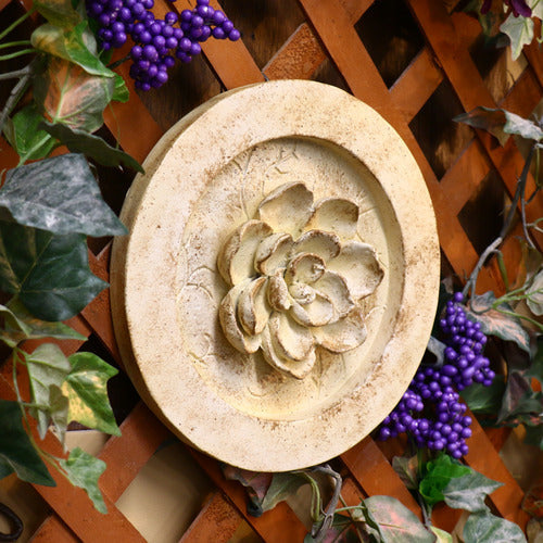 Ornate round medallion with raised floral motif, featuring classical old world European and Renaissance-inspired detailing. Side View