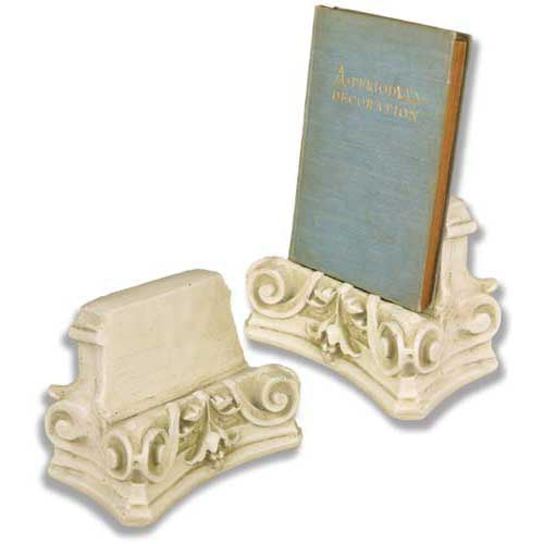 Ornate bookends with classical Greek scrollwork and acanthus leaf detailing in an old world European architectural style.