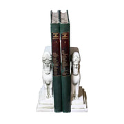 Sphinx-shaped ornate bookends with classical old world European detailing, supporting two upright hardcover books.