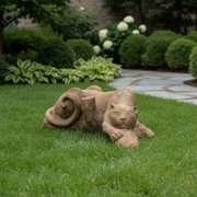 Reclining lion sculpture with classical old world European style, featuring ornate detailing and a relaxed, lifelike pose. Side Angle