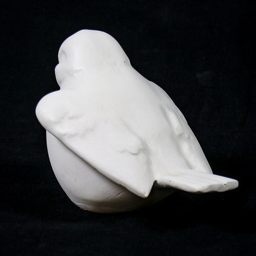 Sculpted bird figurine with classical European style, featuring smooth, rounded lines and subtle, ornate detailing. Side View