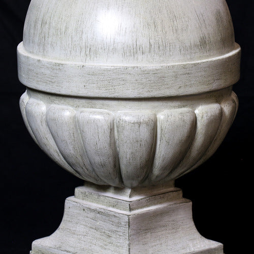 Ornate old world European finials with classical rounded tops and fluted bases, displayed in three graduated sizes on square pedestals. Different Angle