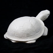 Tortoise sculpture with classical old world European style, featuring smooth, rounded shell and stylized, simplified details. Side View