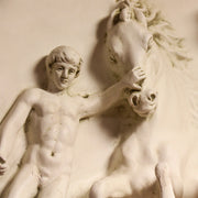 Classical bas-relief sculpture featuring a male figure and three dynamic horses in an ornate, old world European style. Other Angle