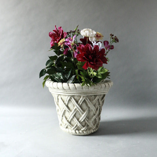 Ornate planter with classical old world European lattice pattern and braided rim, featuring a weathered, antique finish. Side View