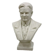 Classical European bust sculpture featuring a man in a suit and tie with detailed, realistic facial features and an ornate base.