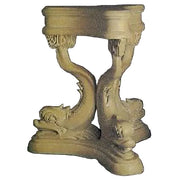 Ornate old world European pedestal table with classical dolphin-shaped legs and intricate carved detailing.