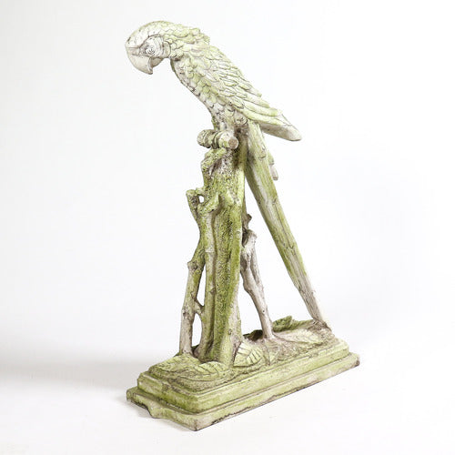 Ornate old world European parrot sculpture perched on a classical pedestal with intricate detailing and elegant, elongated form.