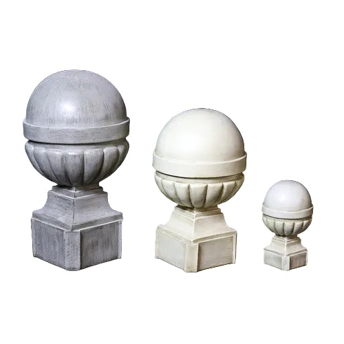 Ornate old world European finials with classical rounded tops and fluted bases on square pedestals in three graduated sizes.