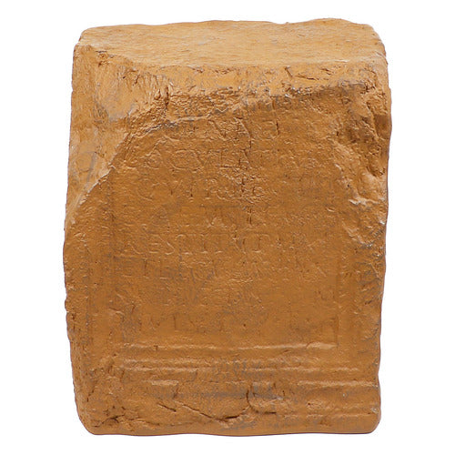 Ancient rectangular stone block with weathered inscriptions, featuring classical old world European architectural detailing.