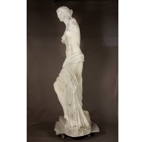 Venus de Milo statue with classical Greek style, draped lower body, armless form, and detailed, ornate sculptural features. Side View