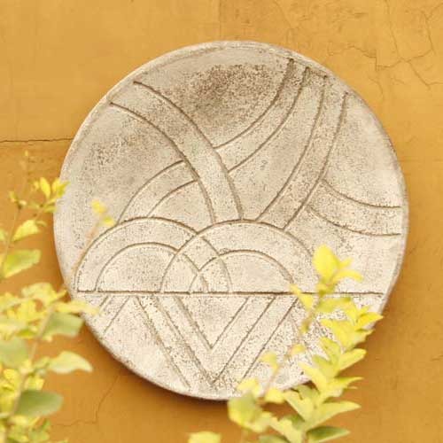 Round decorative plate with geometric Art Deco-inspired patterns and subtle old world European style detailing. Side View
