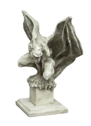 Gothic gargoyle statue with outstretched wings and crouching pose on a square pedestal, featuring ornate medieval detailing.