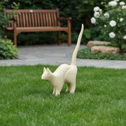 Cat sculpture with elongated tail, minimalist form, and subtle old world European influence in a classical, stylized pose. Side Angle