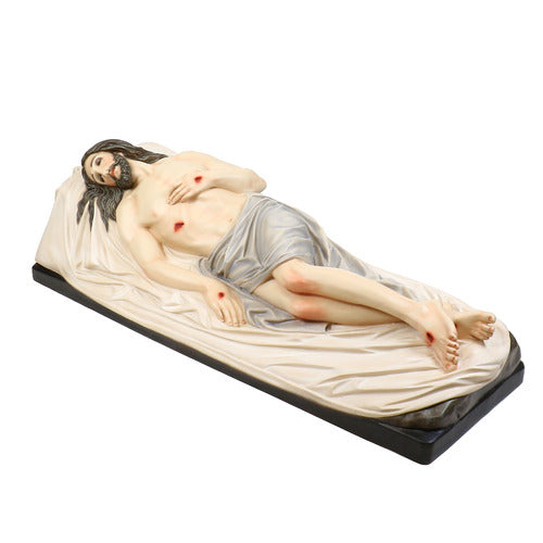 Reclining figure of Christ with classical Renaissance detailing, draped in cloth, featuring ornate, old world European styling.
