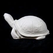 Tortoise sculpture with classical old world European style, featuring smooth, rounded shell and stylized, simplified details. Different Angle