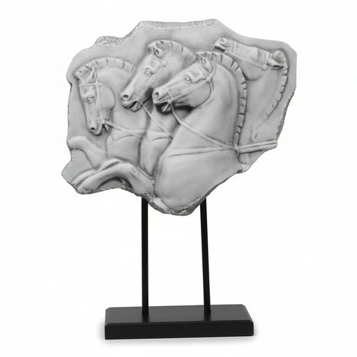 Classical Greek relief sculpture featuring three ornate horses in dynamic motion, mounted on a minimalist black stand.