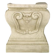 Ornate pedestal base with classical old world European scrollwork and leaf motif, featuring a symmetrical, architectural design.