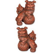 Foo dog statues with ornate, old world European and Baroque detailing, featuring intricate patterns and classical mythical motifs.