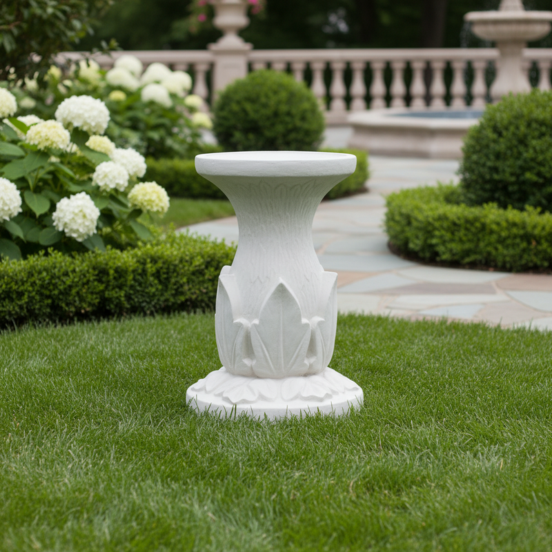Ornate pedestal with classical Greek-inspired fluted column and stylized leaf motifs in an old world European style. Side Angle