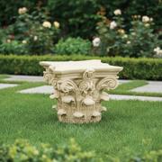 Corinthian column capital with ornate acanthus leaves and scrollwork in classical old world European architectural style. Side Angle