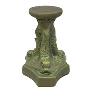 Ornate pedestal with three sculpted fish in classical old world European style, featuring intricate scales and Baroque detailing.