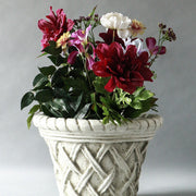 Ornate planter with classical old world European lattice pattern and braided rim, featuring a weathered, antique finish. Side Angle