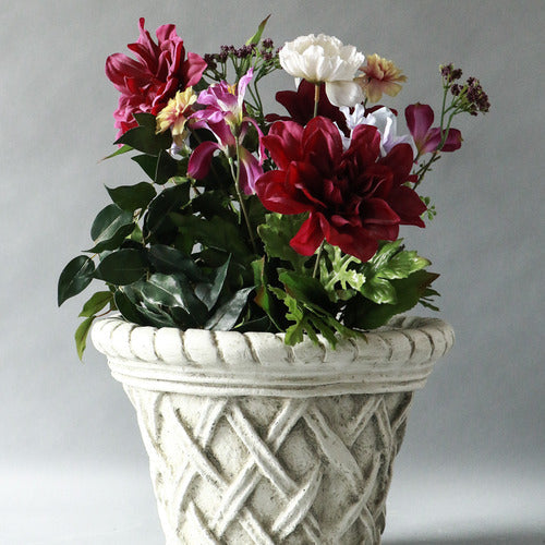 Ornate planter with classical old world European lattice pattern and braided rim, featuring a weathered, antique finish. Side Angle