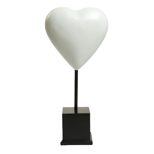Heart-shaped sculpture on a square pedestal stand, featuring smooth, minimalist lines with a classical European influence.
