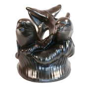 Two ornate dolphins leaping over stylized waves in a classical old world European sculptural design. Additional Angle