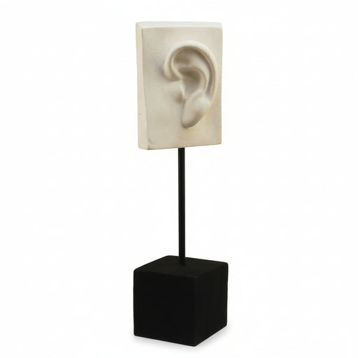 Classical sculpted ear relief on a rectangular plaque, mounted on a minimalist stand with an old world European art style.