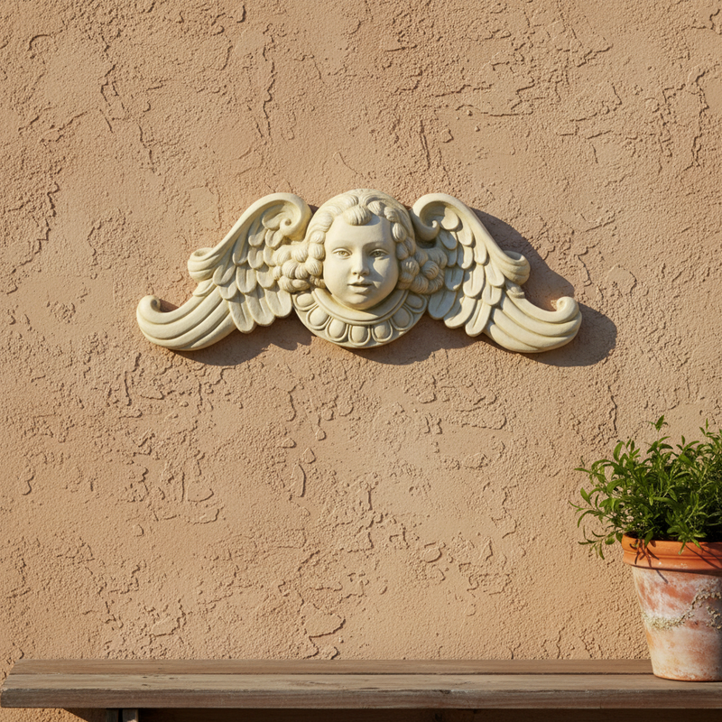 Cherub face with curled hair and ornate wings in classical Baroque style, featuring intricate old world European detailing. Side View