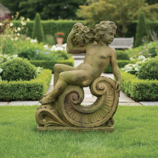 Cherub statue in classical Baroque style, seated on an ornate scroll with floral accents and intricate detailing. Side Angle